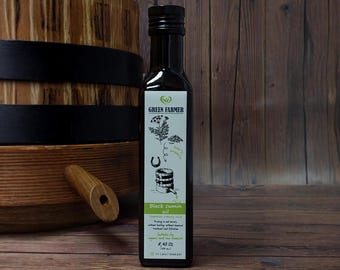Black Cumin Oil. This oil is made from black cumin seeds, cold pressed in oak barrels to ensure purity and rich flavor.