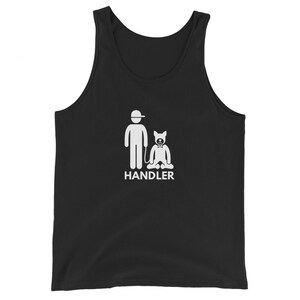 May include: Black tank top with a white graphic of a person with a cap and a dog wearing a bow tie, connected by a leash. The word "HANDLER" is printed below the graphic.