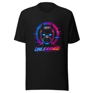 May include: A black short-sleeve t-shirt featuring a graphic of a dog wearing a mask with glowing blue eyes. Behind the dog is a circular neon pink and blue light effect. The word UNLEASHED is printed in a stylized blue and pink font below.
