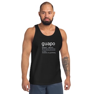 May include: Black tank top with the word "guapo" in white, along with its definition. The definition includes the phrase "like any other guy, just was hotter." The tank top is sleeveless and made of a soft material.