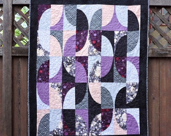 Wall Quilt With Curves of Black, Lavender and Grays