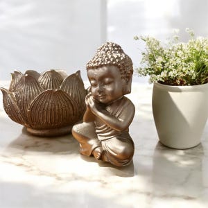 lotus flower candle holder and its Buddha