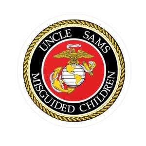 May include: A round sticker featuring the emblem of the United States Marine Corps. The emblem includes a globe, an eagle, and an anchor, surrounded by a red circle with the text "UNCLE SAMS MISGUIDED CHILDREN" in a black font, framed by a gold rope border.