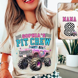 May include: Cream-colored t-shirt with the text "SOPHIA'S PIT CREW" above a pink monster truck with a unicorn graphic. The back of the shirt has the word "MAMA" and the number 8 with a checkered pattern and a monster truck.