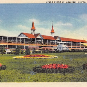 May include: A vintage postcard illustration of the Grand Stand at Churchill Downs in Louisville, Kentucky. The scene features a long building with a red roof and twin spires, set behind a green lawn with several circular flower beds of red blooms.