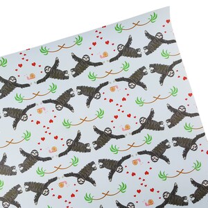 May include: Blue wrapping paper with a repeating pattern of sloths hanging from branches with hearts and snails.