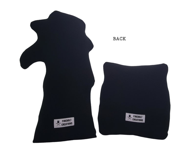 May include: Two black fabric cushions with a white logo that says "Firebolt Creations" and a small graphic of a top hat with crossed swords. The back of one cushion is shown.