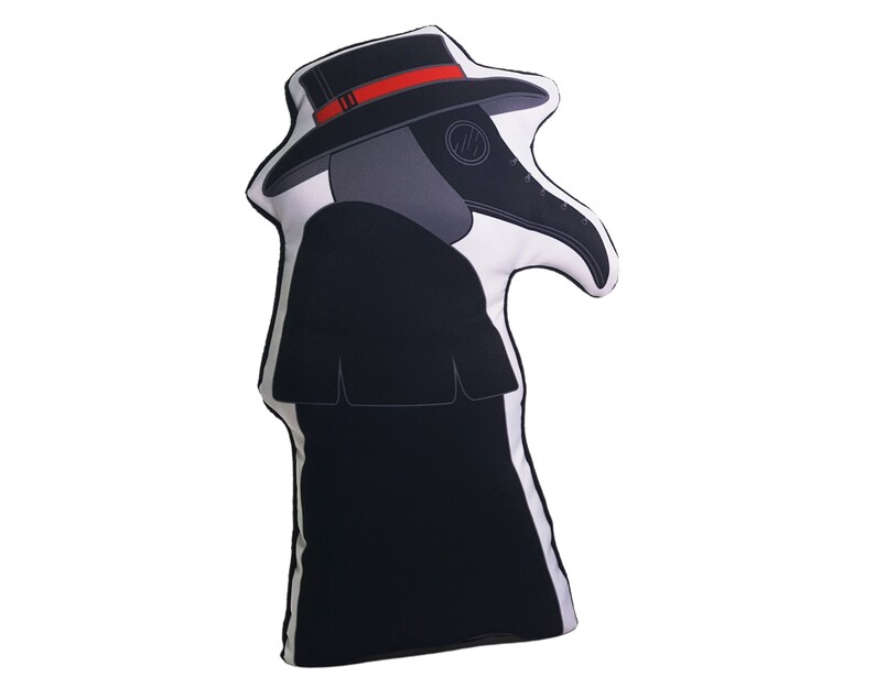 May include: A black and white pillow shaped like a plague doctor wearing a black hat with a red band and a long black coat.