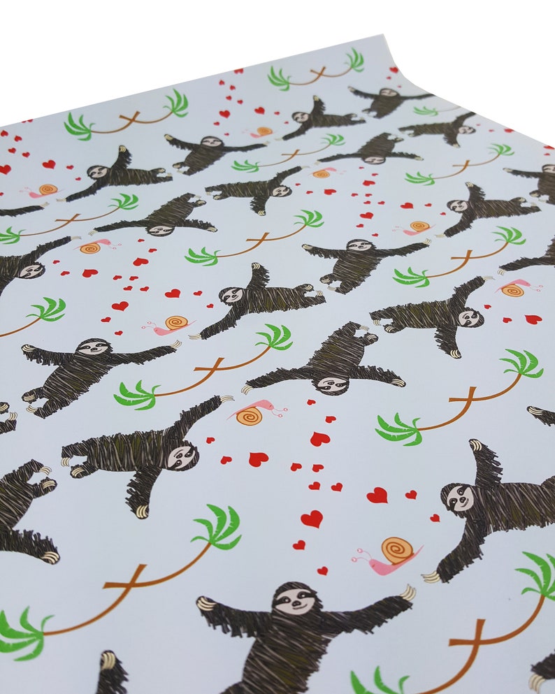 May include: White wrapping paper with a repeating pattern of sloths hanging from palm trees with red hearts and snails.