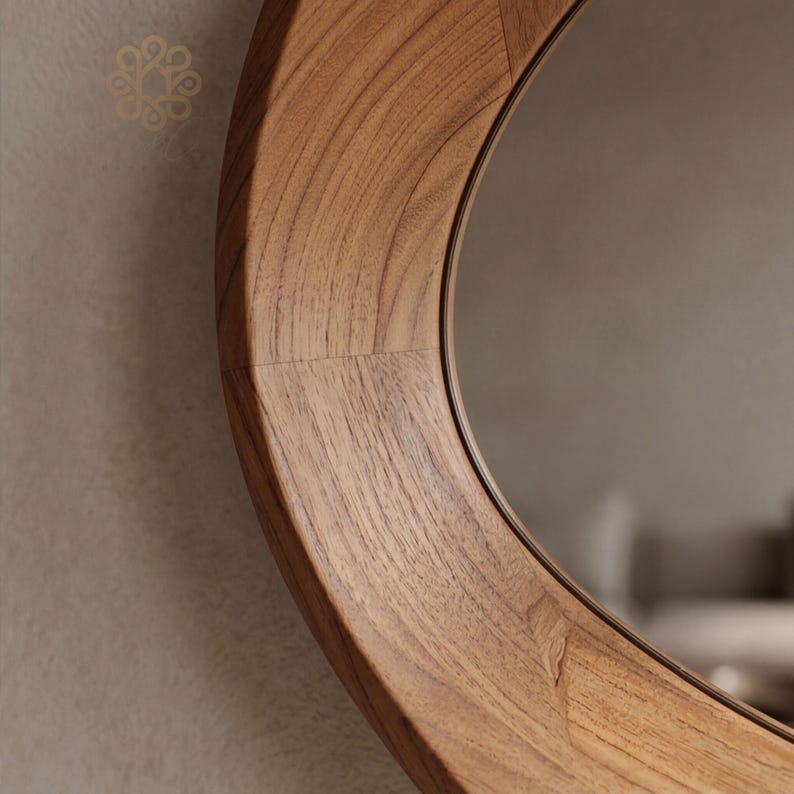 May include: A circular wall mirror featuring a wide, polished wooden frame with a prominent natural grain pattern. The frame is constructed from several segments of light to medium brown wood joined together, surrounding a reflective glass surface.