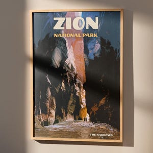 May include: A vintage-style poster featuring a photograph of a narrow canyon in Zion National Park. The poster is framed in wood and has the text "Zion National Park" and "The Narrows" printed on it.