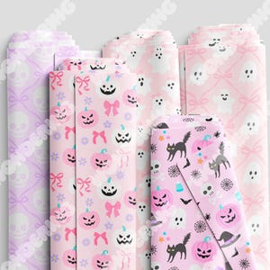May include: Four different pink and white patterned wrapping paper designs. One design features a skull and crossbones, another features a ghost, another features a pumpkin, and the last features a black cat and spider web.