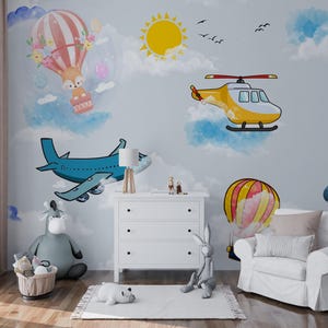 Carta da parati "Avventura nel cielo" - Murale con mongolfiera, razzo e aeroplano per la cameretta dei bambini o l'asilo nido
