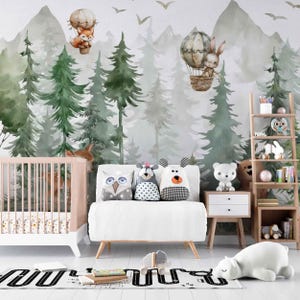 May include: A nursery scene with a forest-themed mural, a crib, a white sofa with animal pillows, a wooden ladder shelf, and a white polar bear rug. Hot air balloons with animal figures float in the air.