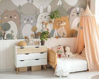 May include: A white bed with a peach canopy and a white and brown animal print wallpaper. The bed has a white duvet and two pillows. There is a dresser with four drawers and a rainbow toy on top of it.