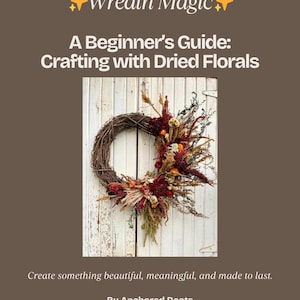 May include: A beginner's guide to crafting with dried florals. The image shows a grapevine wreath adorned with dried flowers in shades of red, orange, and green, set against a white wooden background. The text reads "Wreath Magic".
