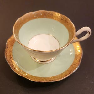 Royal Albert Crown China "Regency" England Pale Green and Gold Teacup & Saucer