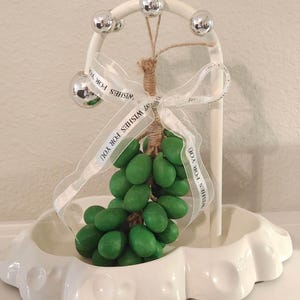 May include: A set of three ceramic mugs with a speckled, matte finish. Each mug features a different color: light blue, cream, and gray. The mugs have a simple, modern design and a comfortable handle.