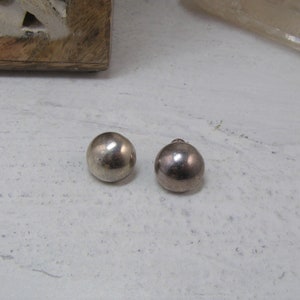 May include: A set of three ceramic mugs with a speckled, matte finish. The mugs are in shades of cream, light gray, and dark gray. Each mug has a simple, minimalist design, perfect for coffee or tea.