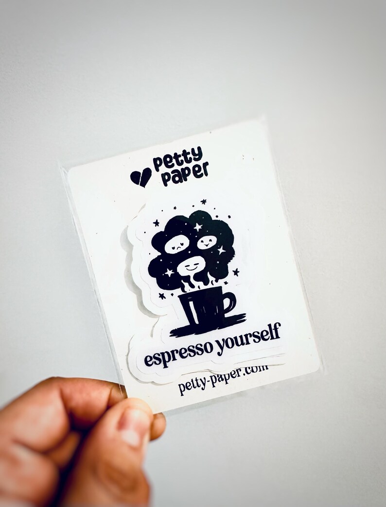 May include: A clear plastic sleeve holding two stickers. The top sticker has the text "Petty Paper" with a heart symbol. The bottom sticker says "espresso yourself" with a coffee cup design. The website petty-paper.com is also visible.