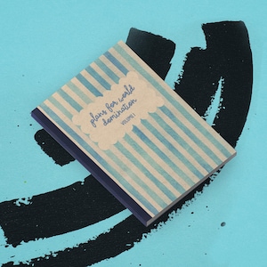 May include: A set of three ceramic mugs with a speckled, matte finish. Each mug features a different color: light blue, cream, and gray. The mugs have a simple, modern design, perfect for coffee or tea.