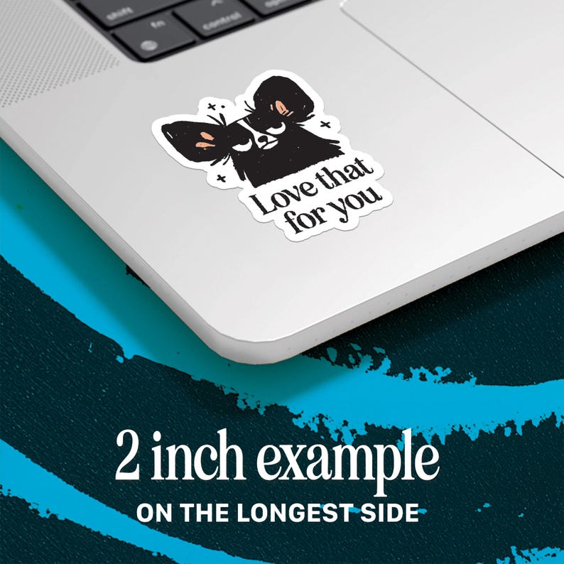 May include: A white sticker with a black illustration of a dog-like creature with the text "Love that for you." The sticker is approximately 2 inches on the longest side.