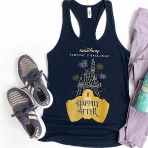 May include: A navy blue tank top with the text "runDisney VIRTUAL CHALLENGE" and a graphic of Cinderella's castle with fireworks. The text "Happily Ever After" is on a gold banner below the castle. The tank top is paired with purple leggings and a teal water bottle with a floral design.