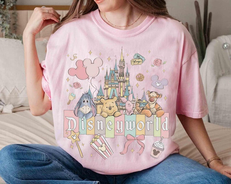 May include: A white ceramic mug with a black handle and the text "But First, Coffee" in a black, handwritten-style font. The mug is on a white surface.