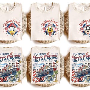 May include: Six off-white t-shirts arranged in two rows. The top row features Disney Cruise 2026 logos with Donald Duck, Pluto, and Goofy. The bottom row displays a Disney Treasure Let's Cruise graphic with a ship, fireworks, and characters.