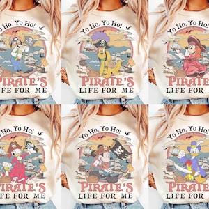 May include: Cream-colored t-shirts with various cartoon pirate characters and the text "Yo Ho, Yo Ho!" and "Pirate's Life For Me" in a vintage style. Each shirt features a different character in a pirate-themed design.