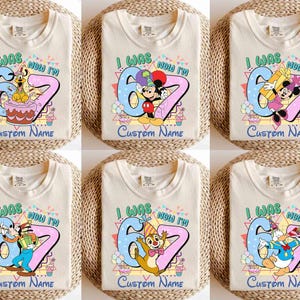 May include: Six cream-colored t-shirts with different Disney character designs. Each shirt has the text "I WAS 6 NOW I'M" with a custom name option. The designs feature characters like Goofy, Mickey Mouse, Minnie Mouse, Chip, and Donald Duck.