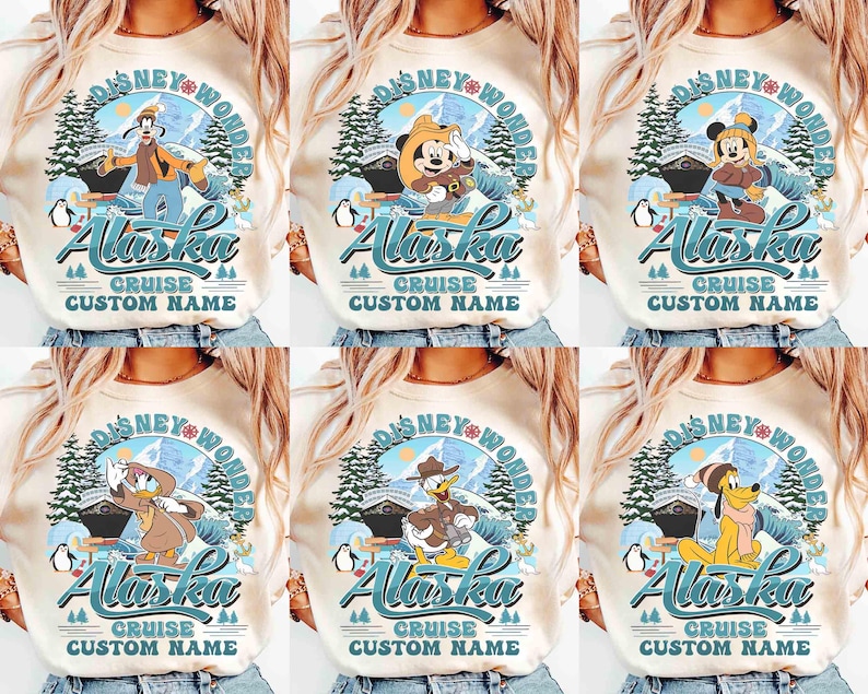 May include: Cream-colored long-sleeve shirts featuring Disney characters in an Alaska-themed design. Each shirt has a circular graphic with the text "Disney Wonder Alaska Cruise Custom Name". The graphics include cartoon characters, mountains, and penguins.