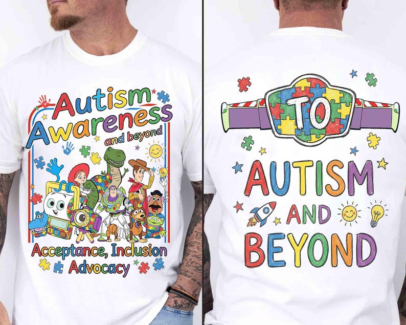 May include: White t-shirt with colorful text and graphics promoting autism awareness. The front features the words "Autism Awareness and beyond" with cartoon characters. The back says "TO Autism and Beyond".
