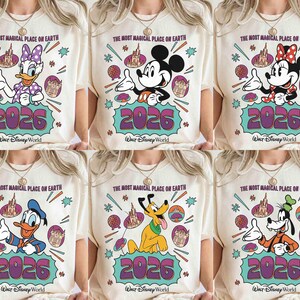 May include: Cream-coloured t-shirts featuring Disney characters: Daisy Duck, Mickey Mouse, Minnie Mouse, Donald Duck, Pluto, and Goofy. Each shirt has the text "THE MOST MAGICAL PLACE ON EARTH" and "2026 Walt Disney World" in a colourful design.
