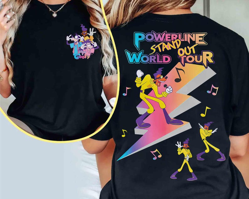 May include: Black t-shirt with a graphic of Goofy and his friends. The graphic says "Goofy" and is in a cartoon style. The t-shirt also has the text "Powerline Stand Out World Tour" in a colorful, stylized font.