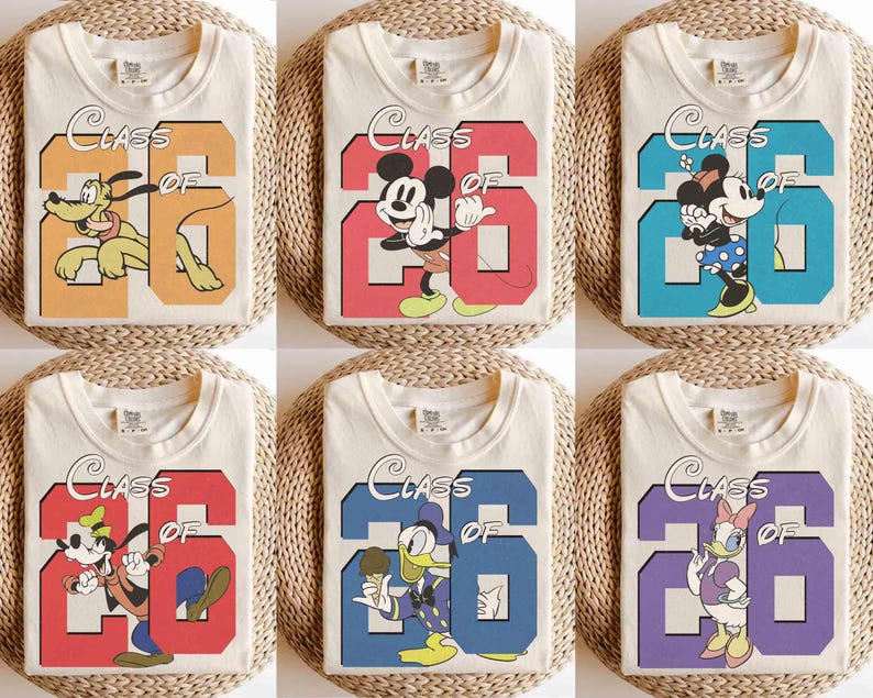 May include: Cream-colored t-shirts featuring various Disney characters and the text "Class of '26". Designs include Pluto, Mickey Mouse, Minnie Mouse, Goofy, Donald Duck, and Daisy Duck, each set against a colorful number 26.