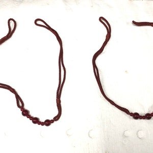 Package of 2 Burgandy 28 Inch Curtain Tiebacks. DW21