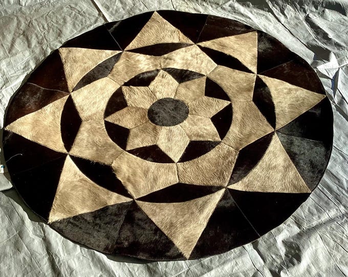 5 Foot Diameter Brindle and Tan Hair on Cowhide Rug. RUG03