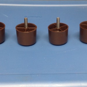 Brown plastic furniture legs 1 1/2" in packages of 4 FLBR02