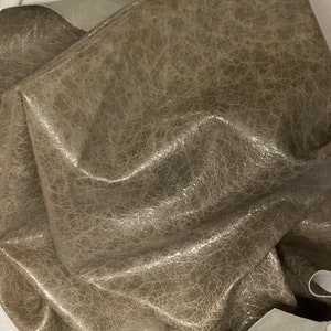 10 square feet stone gray leather distressed Lambskin.  OSM1583