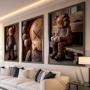 May include: Three framed woodblock prints of cartoon characters with a wood grain texture. The characters are brown and have a simple design. The prints are hung on a wall in a living room setting.