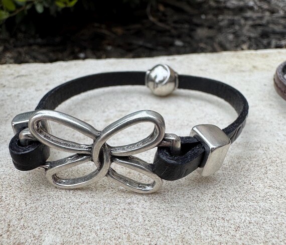 Embossed leather bracelet with stainless steel twisted butterfly connector, dark brown or black