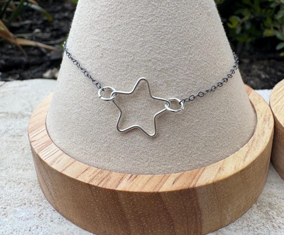 Sterling silver star chain bracelet on oxidized cable chain