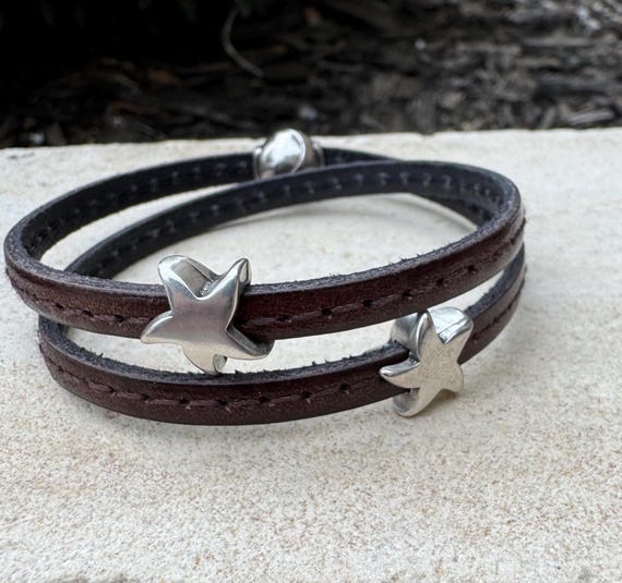 Leather wrap bracelet with silver star sliders and magnet closure