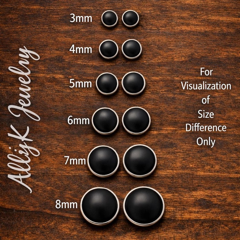 May include: A wooden surface displays a collection of black stud earrings in various sizes, ranging from 3mm to 8mm. Each pair is accompanied by a size label. The text "For Visualization of Size Difference Only" is also present.