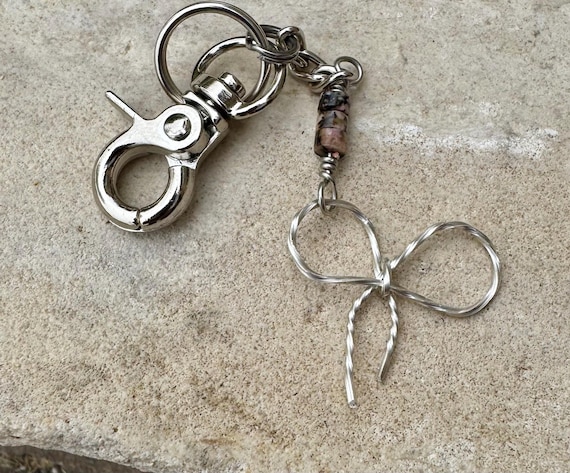Keychain with black pink rhodonite gemstones and sterling silver bow