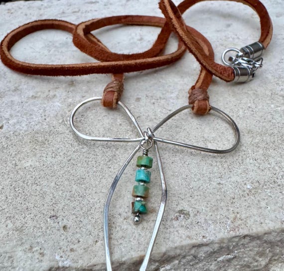 Sterling silver handmade bow on genuine deerskin single leather lace with turquoise dangle