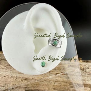 May include: A silver-colored ear cuff with a serrated bezel and a small turquoise stone, and a matching stud earring with a smooth bezel and turquoise stone. The text "Serrated Bezel Example" and "Smooth Bezel Example" is visible.