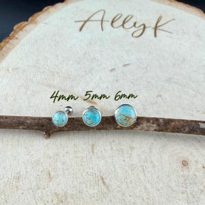 May include: Three turquoise stud earrings in sizes 4mm, 5mm, and 6mm, displayed on a wooden branch. The earrings have a silver bezel setting. The background is a light-colored wooden surface with the text "Allyk" and size measurements.