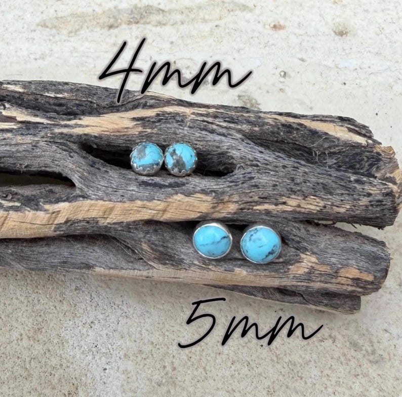 May include: Two pairs of turquoise stud earrings, 4mm and 5mm, displayed on a piece of driftwood. The earrings have a silver setting and a bright blue stone with a mottled pattern. The text "4mm" and "5mm" is written in black.
